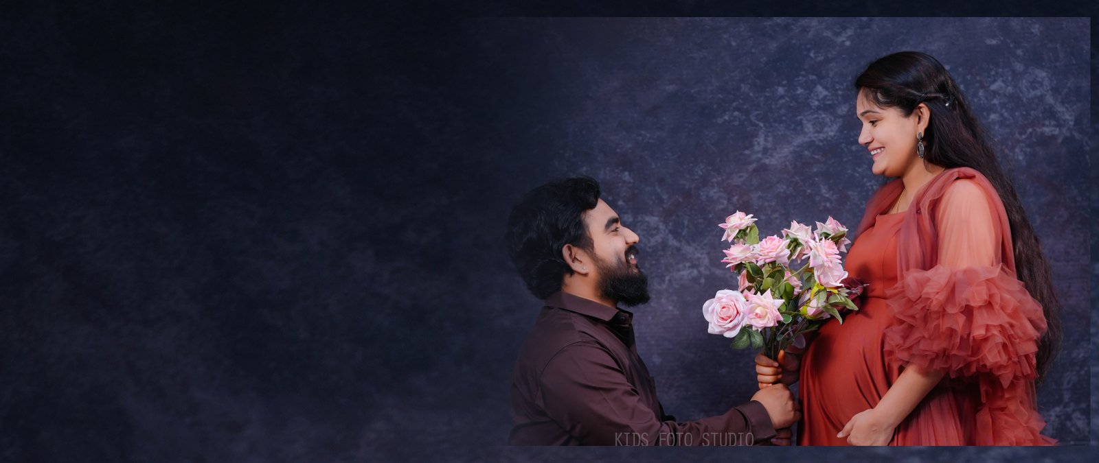 Expecting mother in a beautiful studio maternity portrait